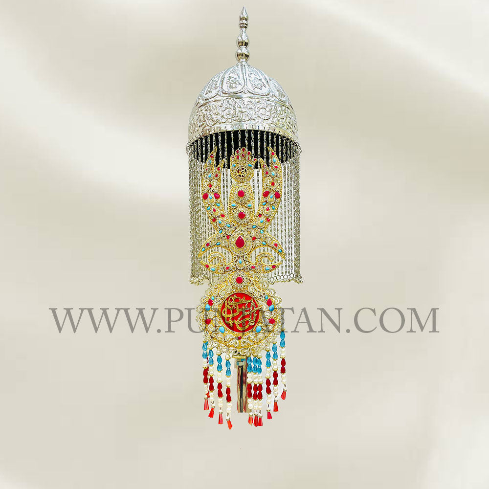 The resplendent Kashi Punja of Mola Abbas (as) intricately adorned with an array of precious stones and silver khoud